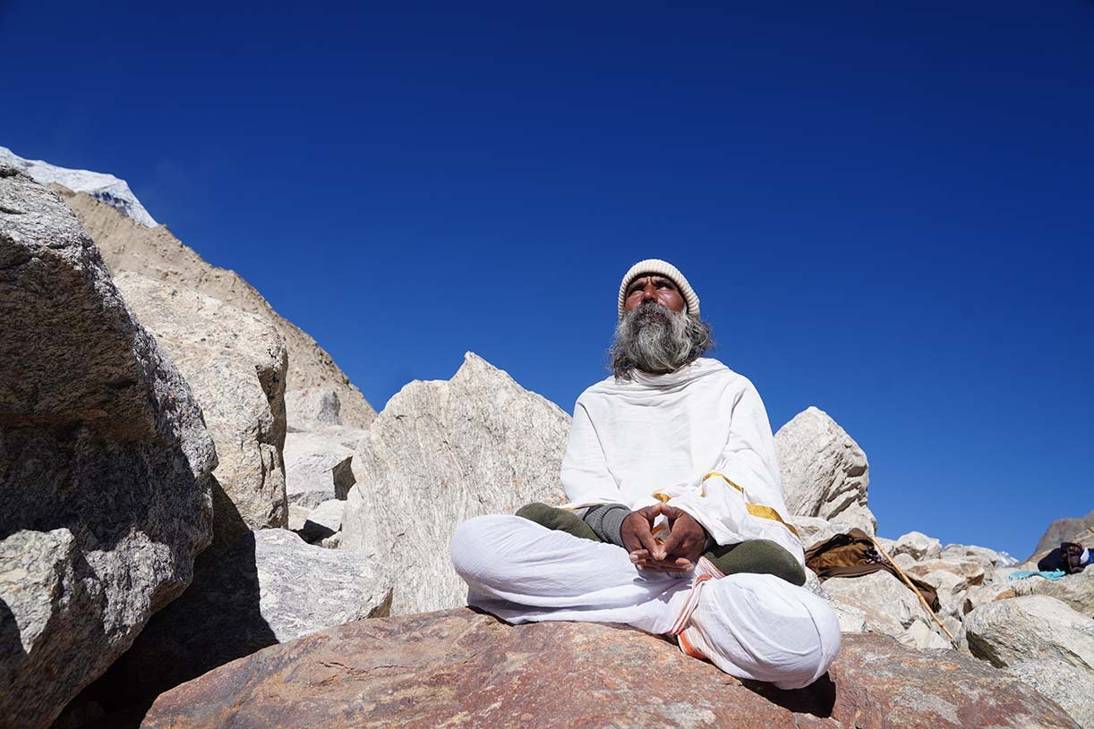 yogi meditating mountain landscape india